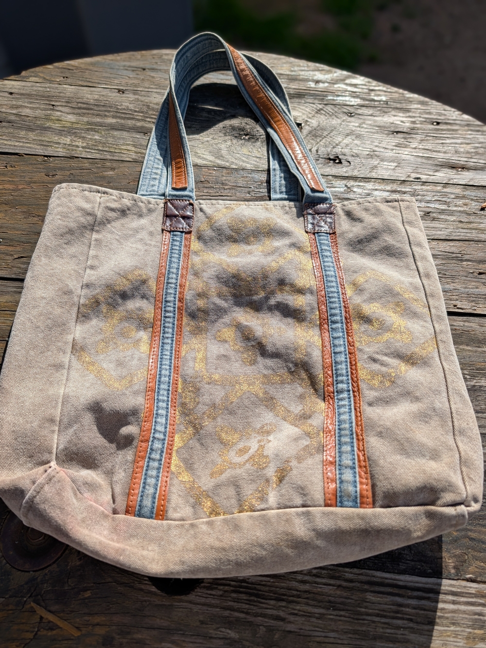 Mona B Beige Canvas Tote with Brown Leather Trim and Blue Straps.